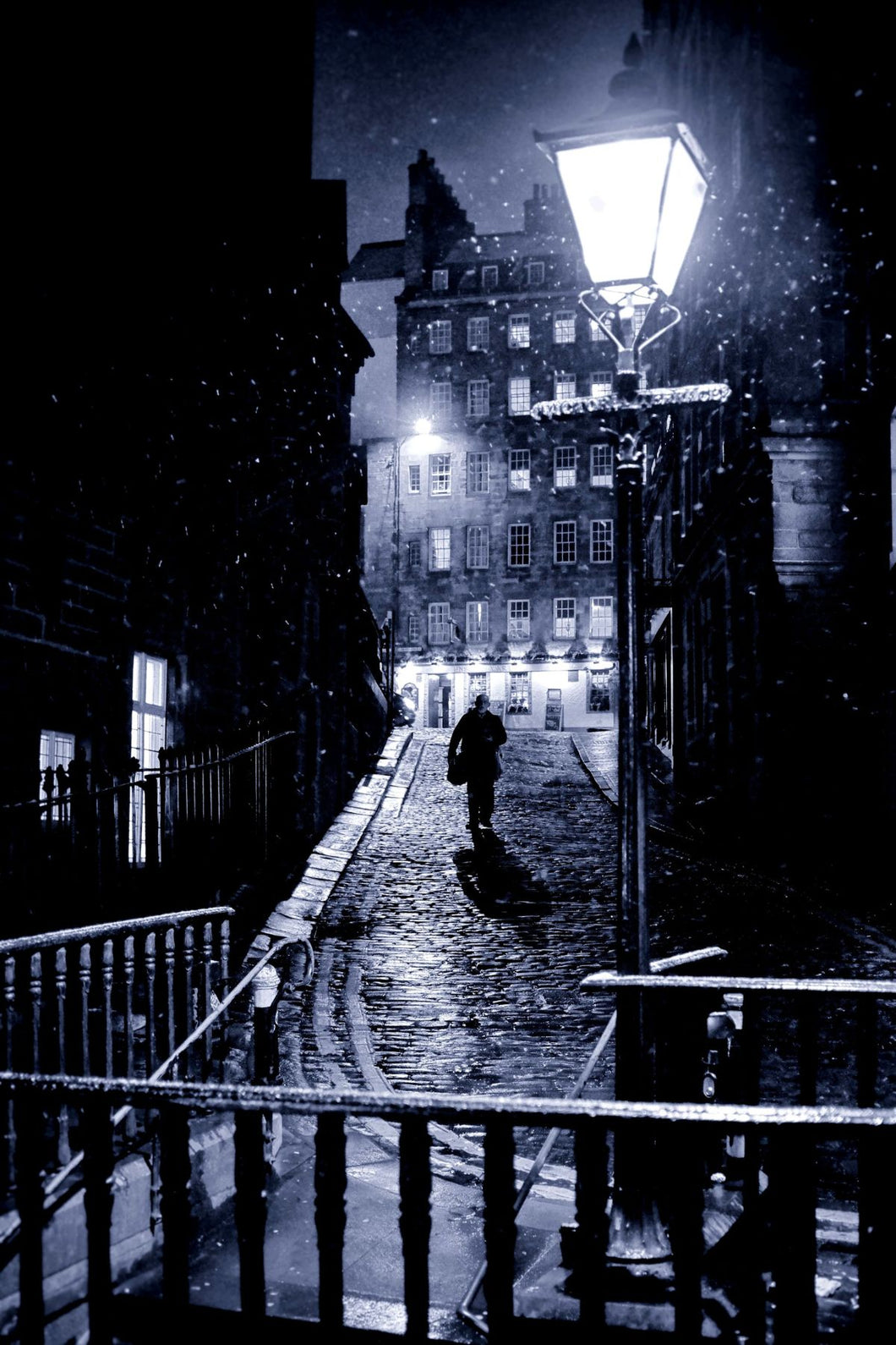 Man Walks in the Snow and Darkness in Edinburgh by Scott Liddell